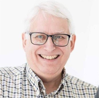 Portrait of a smiling business owner in a modern office